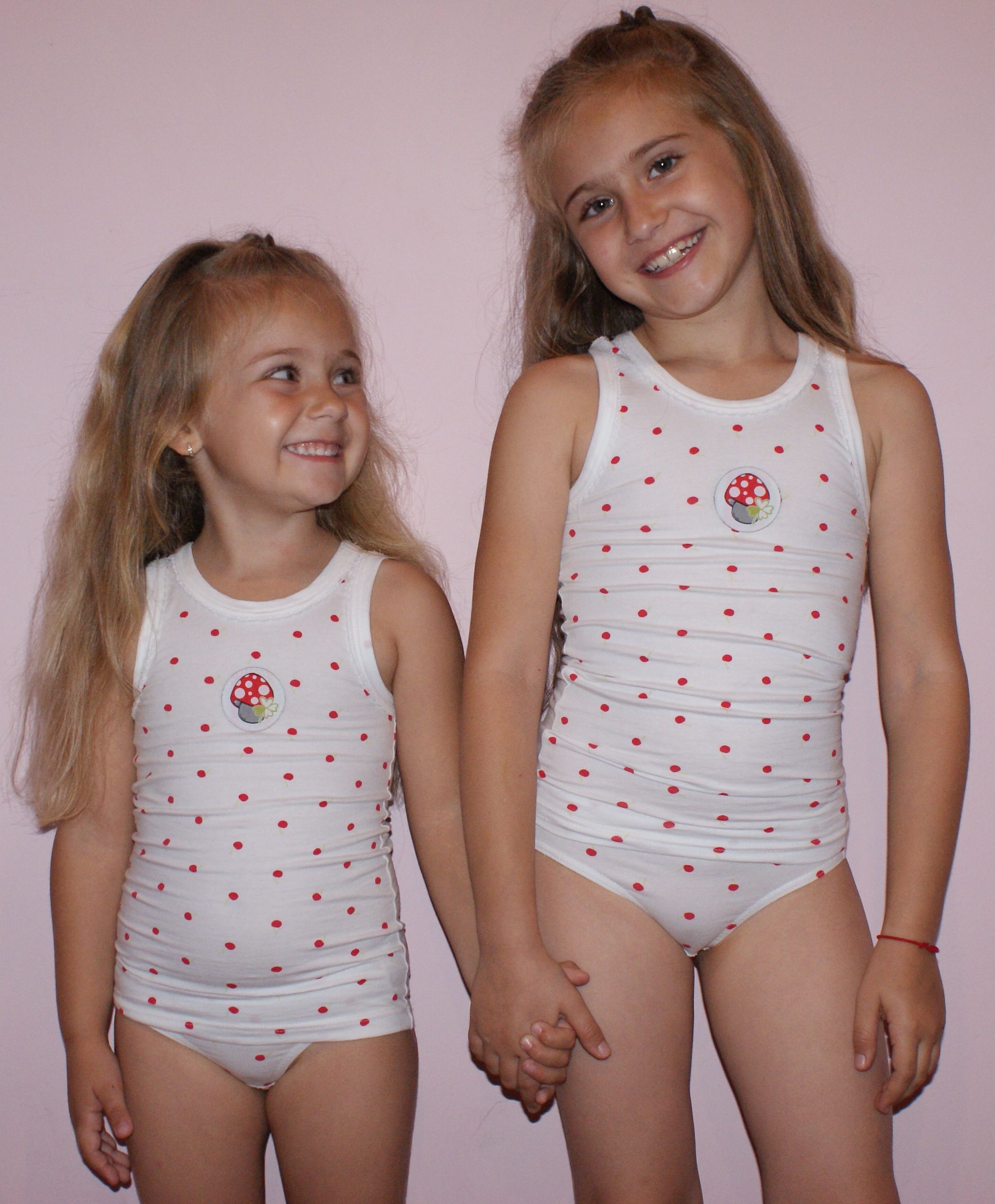 two young girls in polka-dot undershirts and panties
